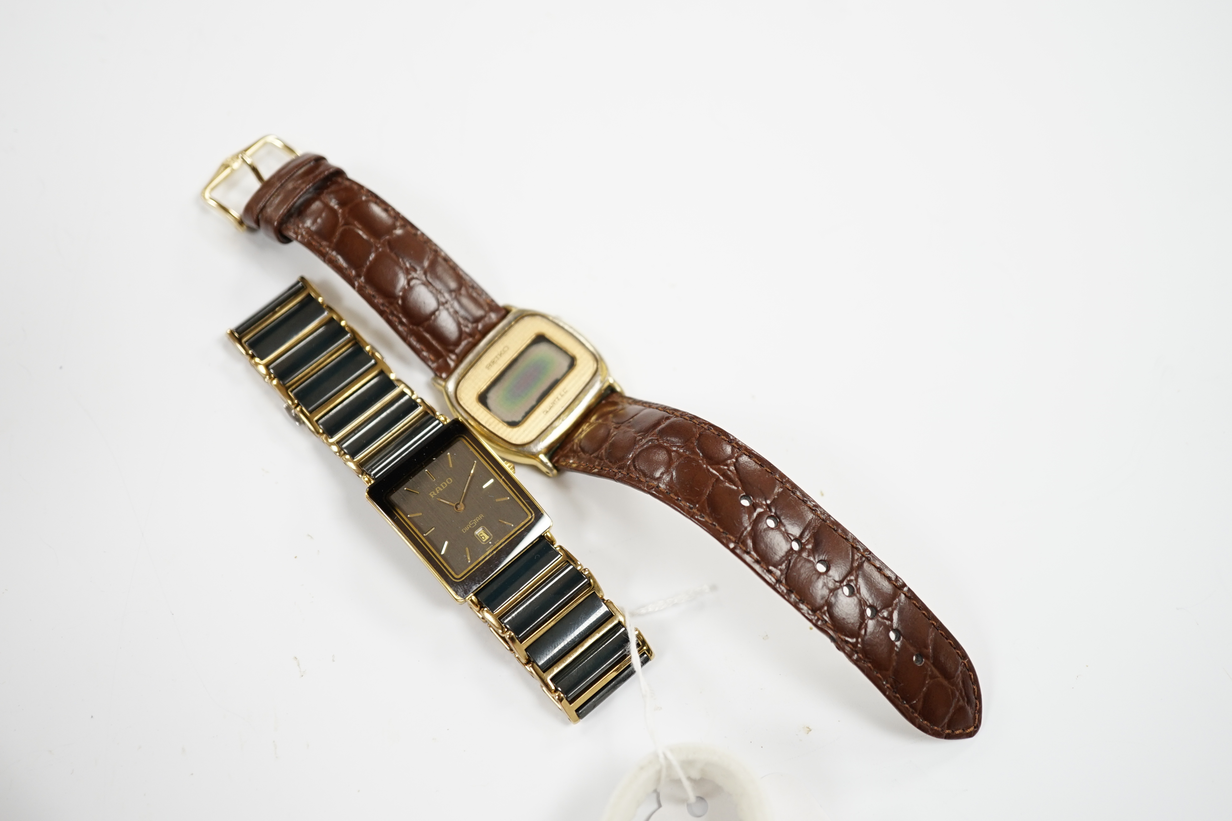A gentleman's ceramic and gilt steel Rado Diastar wrist watch and a Seiko wrist watch.